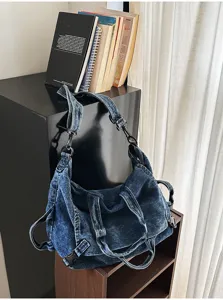 Retro washed denim shoulder bag with multi-strap detail, perfect for casual daily wear.
