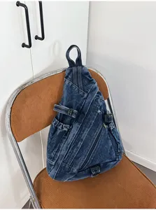 Vintage washed denim chest bag detail, casual retro triangle crossbody sling backpack.