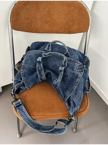 Washed denim motorcycle bag detail view, large capacity casual shoulder messenger bag for women.