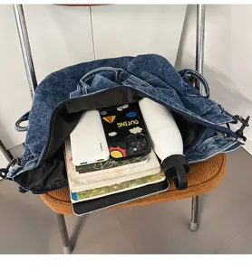 Detailed interior view of the vintage washed denim tote bag with large capacity space.