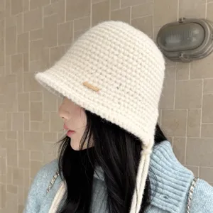 Women's knitted bucket hat with ties, warm autumn winter solid color crochet basin hat stylish.