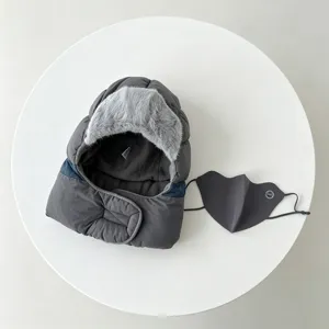 Detail view of the thickened thermal trapper hat with fleece lining and matching windproof mask.