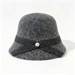 Detail shot of grey wool bucket hat with elegant crisscross ribbon and pearl button accent.