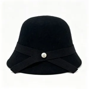 Detail view of black wool cloche hat with elegant ribbon and pearl button decoration.