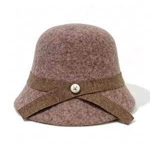 Closeup view of the stylish brown wool felt bucket hat featuring a chic ribbon and pearl button.
