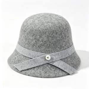 Grey wool bucket hat detail showing vintage bow ribbon and elegant pearl accent for winter.