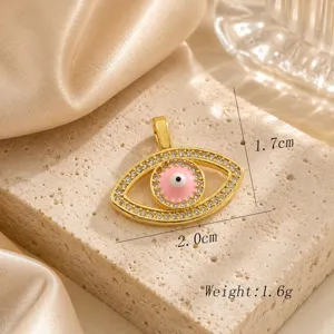 Exquisite evil eye pendant detail shot, luxurious 18k gold plated copper with sparkling zirconia.