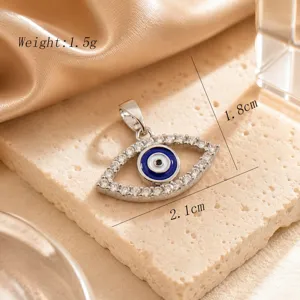 Detail shot of a stylish evil eye pendant sparkling with cubic zirconia stones and blue enamel.