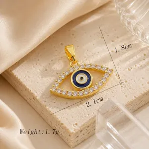 Close-up detail of the evil eye pendant, showing fine zircon micro-setting and gold plating.