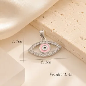 Silver-plated evil eye pendant with pink enamel and sparkling cubic zirconia stones. Size 2.1cm.