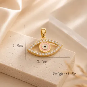 Luxurious 18K gold plated evil eye pendant featuring sparkling cubic zirconia and pink enamel.
