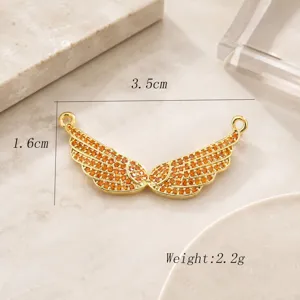 Connecteur de pendentif de bijoux d'aile d'ange plaqué or avec des pierres ambrées.