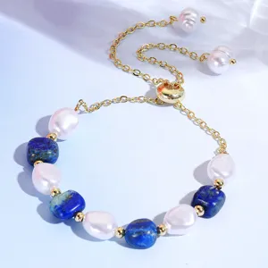Exquisite detail view of natural stone and pearl adjustable beaded bracelet with gold chain.