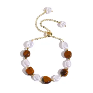 Adjustable natural stone and pearl bracelet, elegant gold tone design for women fashion dailywear.
