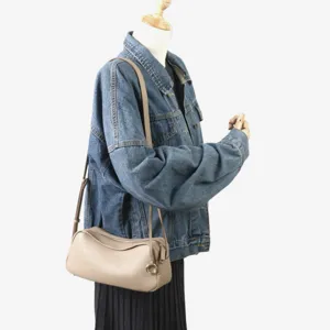 Sac bandoulière souple en cuir minimaliste, style croissant polyvalent pour le quotidien.