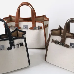 Sac cabas en toile avec garniture en cuir de vachette, sac à main élégant pour femme.