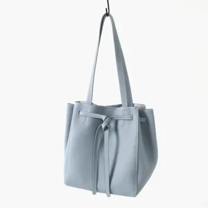 Sac cabas seau en cuir de vachette véritable avec nœud élégant pour femmes actives.