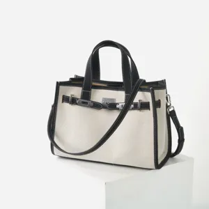 Elégant sac cabas fourre-tout femme en toile et cuir véritable pour le travail chic.