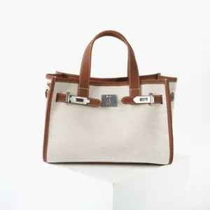 Sac cabas pour femme en toile et cuir, élégant sac à main de commuting avec serrure.
