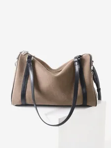 Sac à bandoulière minimaliste en toile et cuir noir, élégant sac quotidien pour femmes.