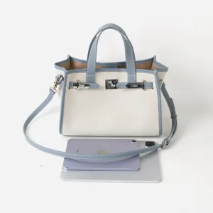 Sac cabas en toile et cuir élégant sac à main fourre-tout pour femme avec serrure en métal.