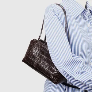 Crocodile embossed leather underarm bag, chic brown shoulder handbag for women commute daily.