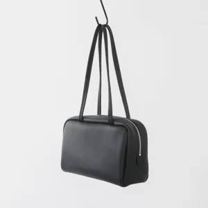 Sac bowling minimaliste en cuir véritable, sac porté épaule élégant pour les femmes.