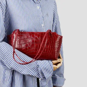 Red crocodile embossed leather underarm bag showcasing premium texture, elegant daily commute style.