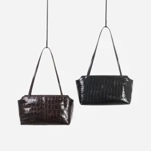Crocodile embossed cowhide shoulder bag, chic commuter leather handbag detail view.