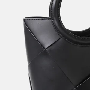 Black leather geometric woven handbag detail modern luxury chic minimalist tote bag stylish purse