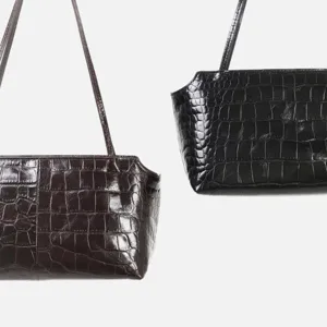 Crocodile pattern leather underarm bag, elegant minimalist design with slim shoulder strap.