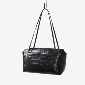 Close-up view of the black crocodile embossed cowhide underarm handbag showing texture.