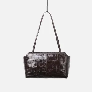 Detailed close-up view of the dark brown crocodile embossed leather shoulder bag strap.