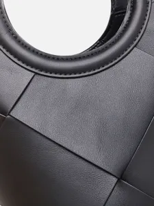 Elegant black leather woven handbag featuring a chic circular handle and modern geometric design.