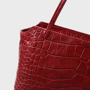 Red crocodile embossed leather underarm bag detail, top handle commute handbag fashion chic