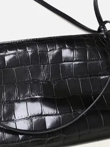 Black crocodile embossed leather underarm bag, elegant shoulder bag for women daily commute.