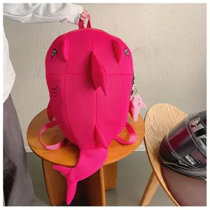 Cute pink shark monster backpack large capacity school bag with funny fins and tail design.
