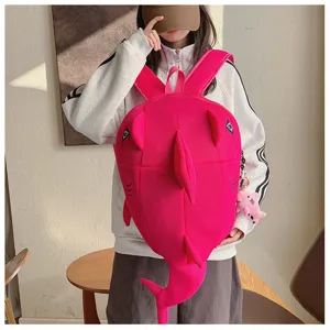 Detailed view of the cute pink shark backpack, featuring 3D fins, tail and playful pendant.