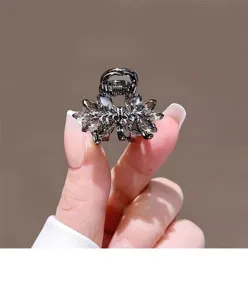 Petite pince a cheveux noeud cristal noir metal mini griffes cheveux pour femmes elegantes.