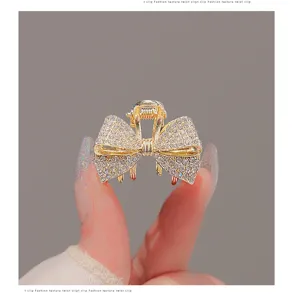 Pince à cheveux nœud papillon en strass brillants pour femmes accessoires élégants détails