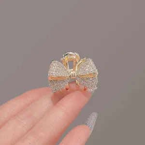 Élégant pince à cheveux nœud strass, mini griffe cheveux dorée pour coiffure élégante.