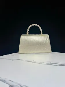 Elegant gold evening bag with sparkling rhinestone twisted handle for classy party events.