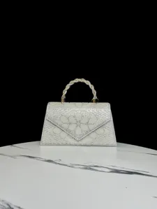 Rhinestone pearl evening bag detail, elegant woven handle sparkling diamond flap handbag, formal party accessory.