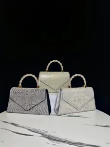 Sparkling rhinestone pearl evening handbag, elegant twisted handle shoulder bag for party.
