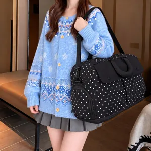 Large capacity travel duffel bag with classic black and white polka dots for weekend trips.