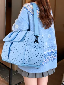 Large capacity travel duffel bag with chic polka dots, lightweight and portable for trips.