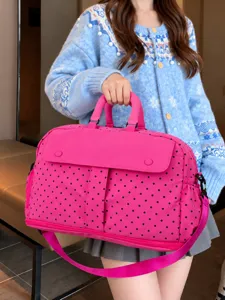 Large capacity travel duffel bag with stylish polka dot pattern for lightweight weekend trips.