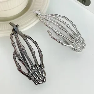 Pince a cheveux squelette en metal gothique, accessoire tendance pour femme.