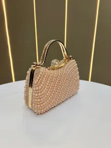 Elegant pearl rhinestone evening clutch bag versatile metallic chain handbag luxury purse detail.