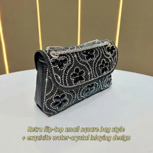 Black rhinestone flap bag detail with exquisite crystal inlay and sparkling evening chain strap.